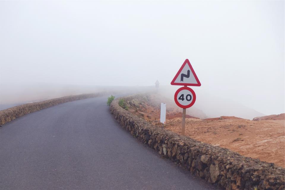 speedlimit signs road pavement fog 