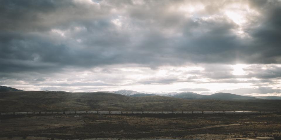 landscape, train, storm, clouds, cloudy, fields, mountains, hills, rural