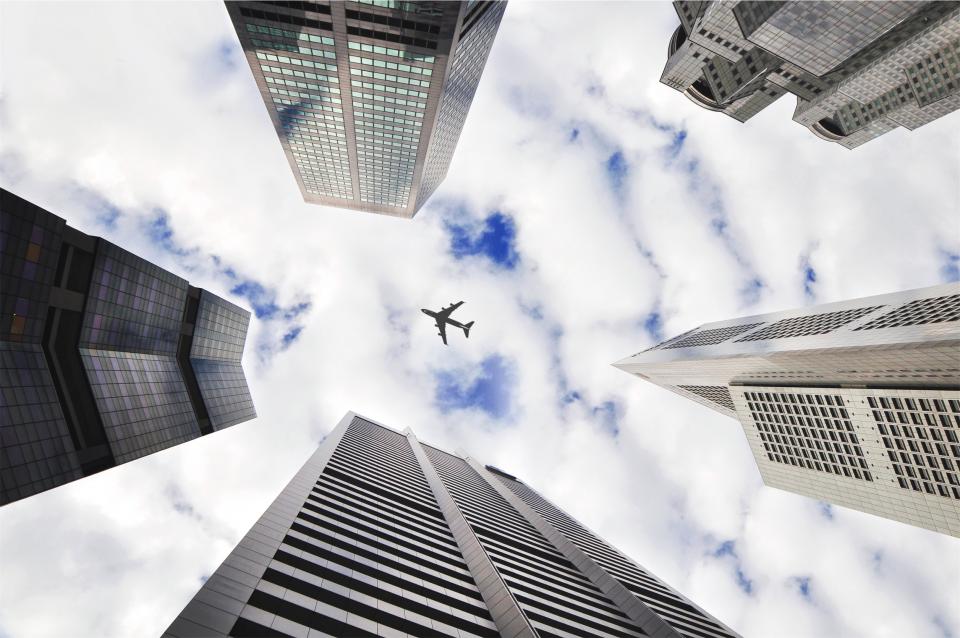 trip travel transportation towers sky clouds city buildings architecture airplane 