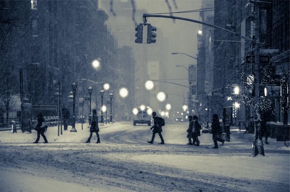 winter streets snow roads people pedestrians lights lampposts city buildings blizzard 