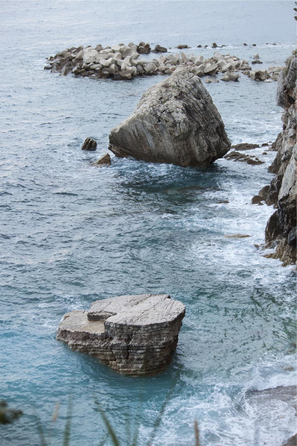 waves water shore sea rocks ocean coast boulders 