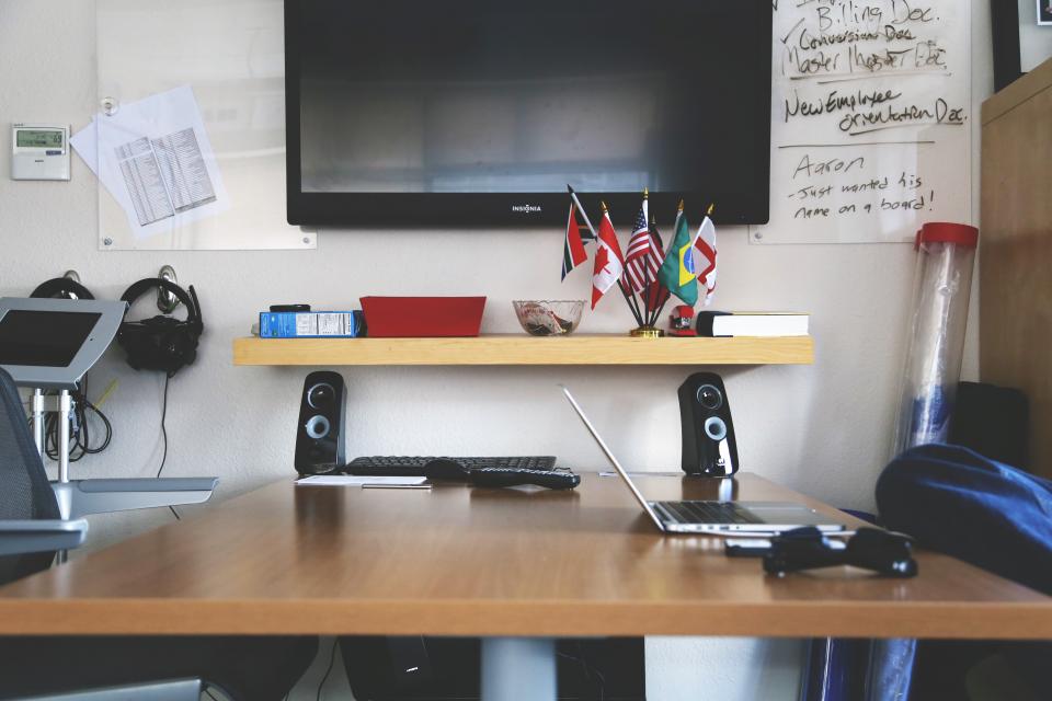 tv television technology speakers office laptop desk business 