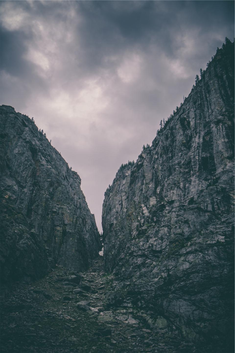 rocks mountains dark cloudy cliffs 