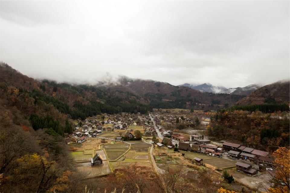 village town Shirakawago mountains landscape japan houses cloudy agriculture 
