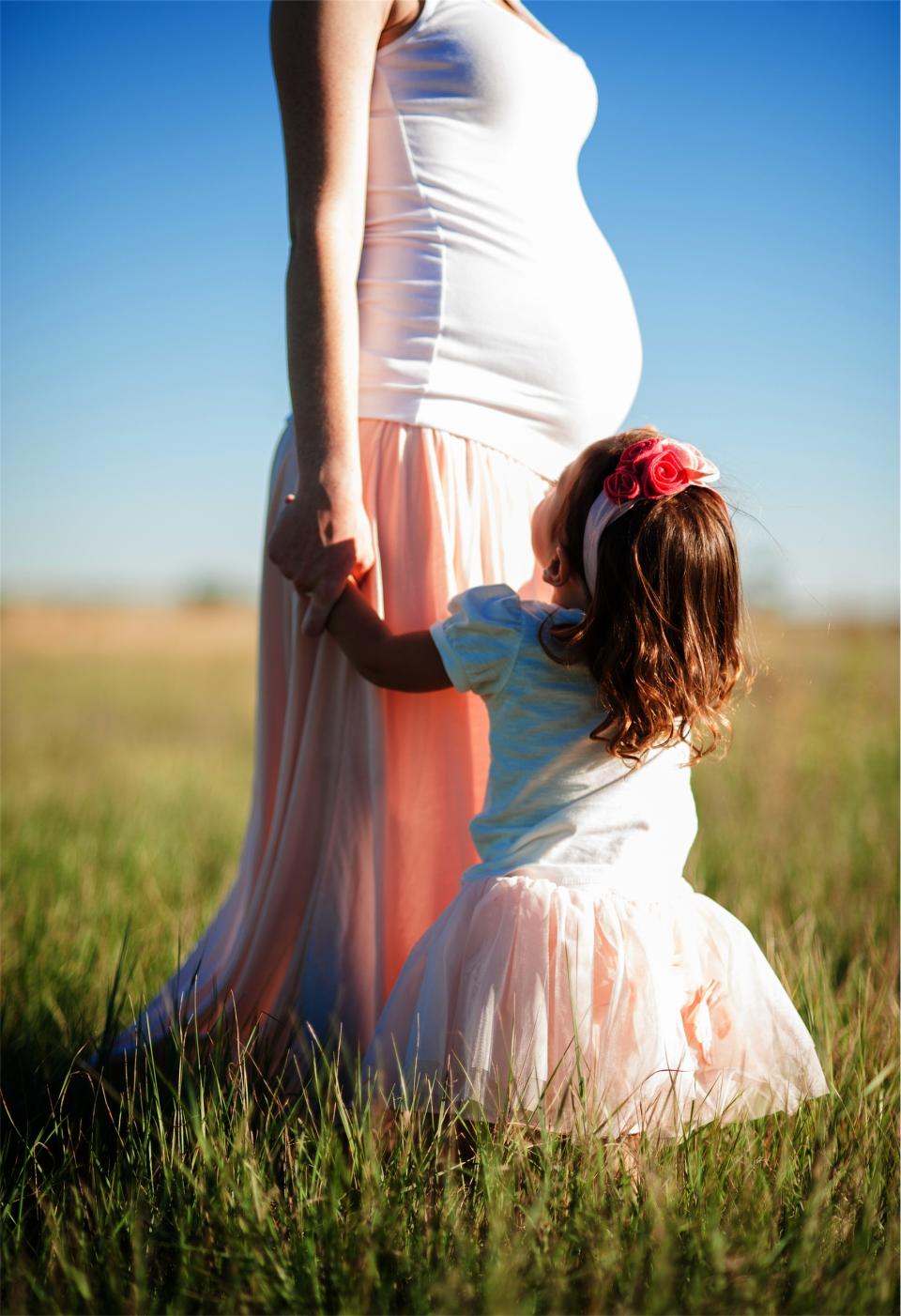 young woman pregnant people mother mom girl family dress daughter child baby 