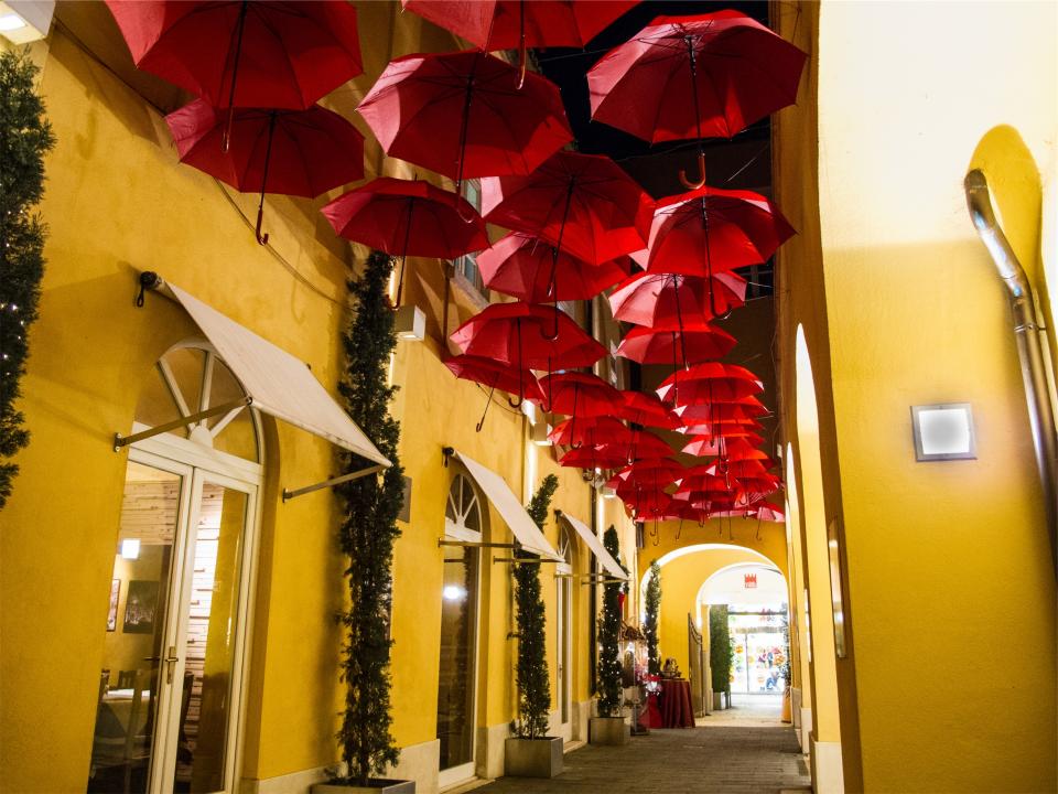 umbrellas street stores shops restaurant alley 