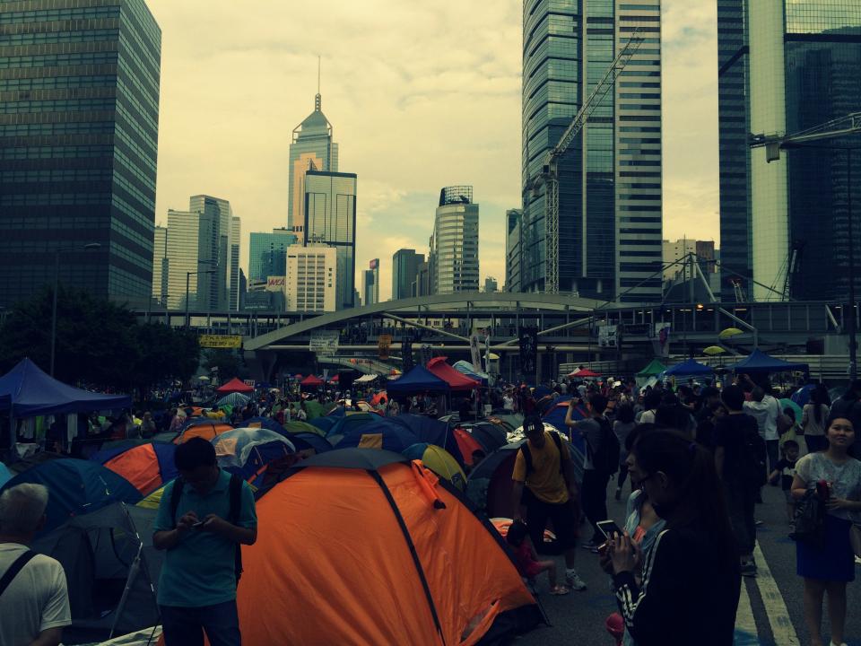 towers tents streets protest people hongkong crowd city busy buildings architecture 