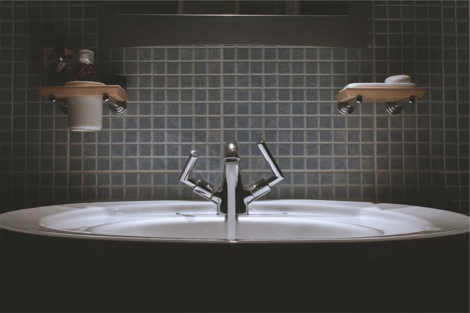 water toothpaste tiles tap soap sink faucet bathroom backsplash 