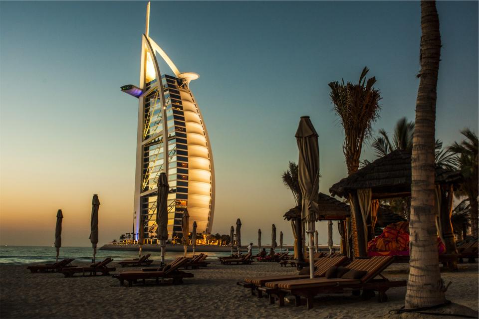 vacation sunset sea sand ocean loungechairs hotel dusk Dubai BurjAlArab beach architecture 