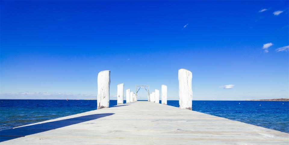 wood sky sea posts ocean dock blue 