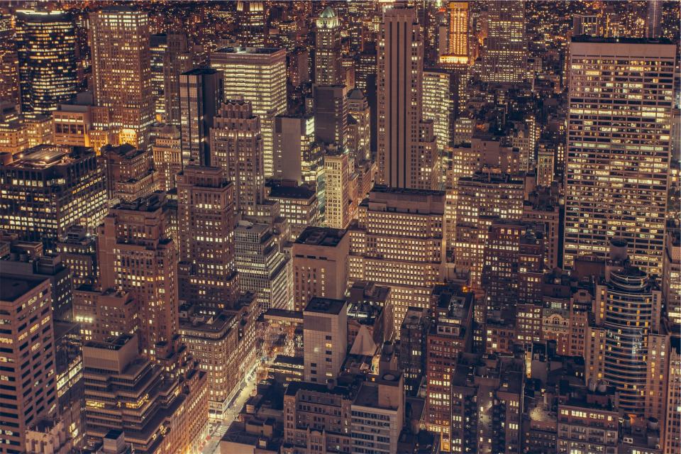 urban towers skyline rooftops NYC night NewYork lights highrises dark city buildings architecture aerial 