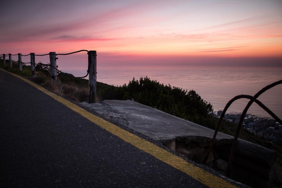 sunset sky sea road pavement ocean dusk 