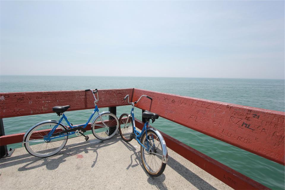 water sea railing pier ocean horizon bikes bicycles 