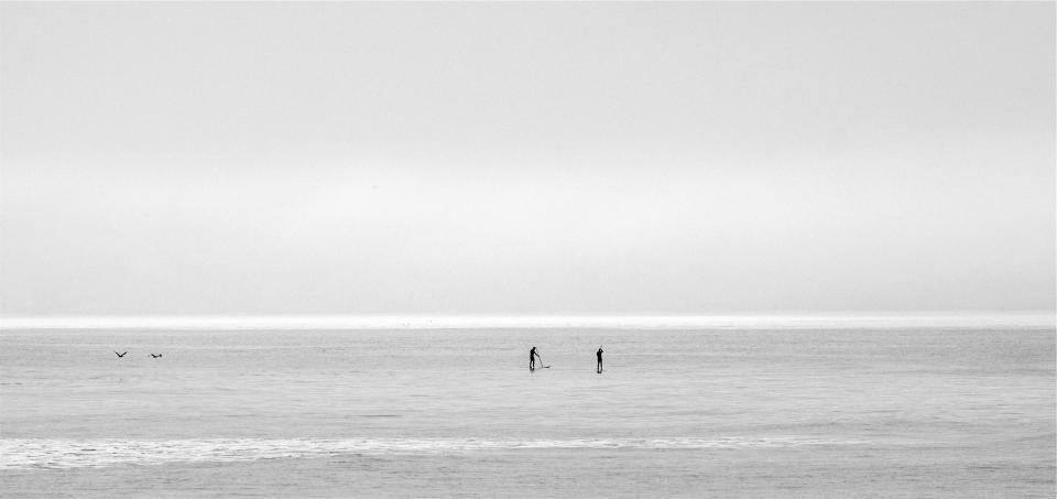 sky sea paddleboarding ocean horizon blackandwhite 