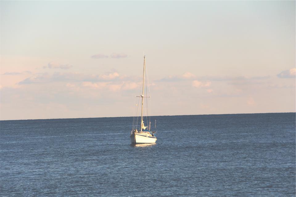 water sunshine sky sea sailboat ocean horizon 