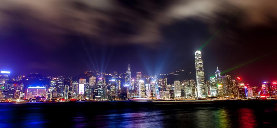 water urban towers skyline sky night lights LED lasers hongkong highrises evening dark city buildings architecture 