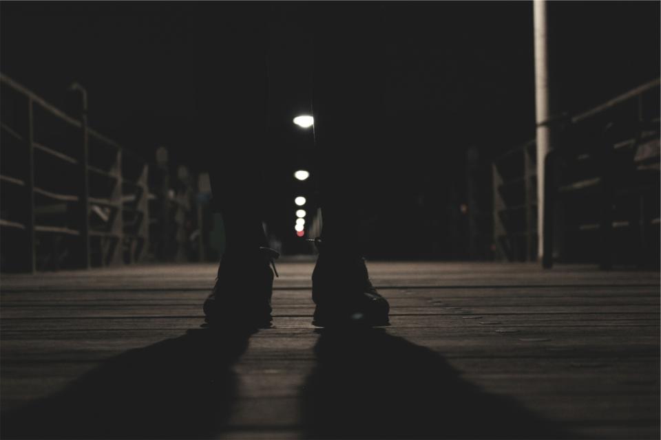 wood shoes shadows pier pants night evening dark boardwalk 