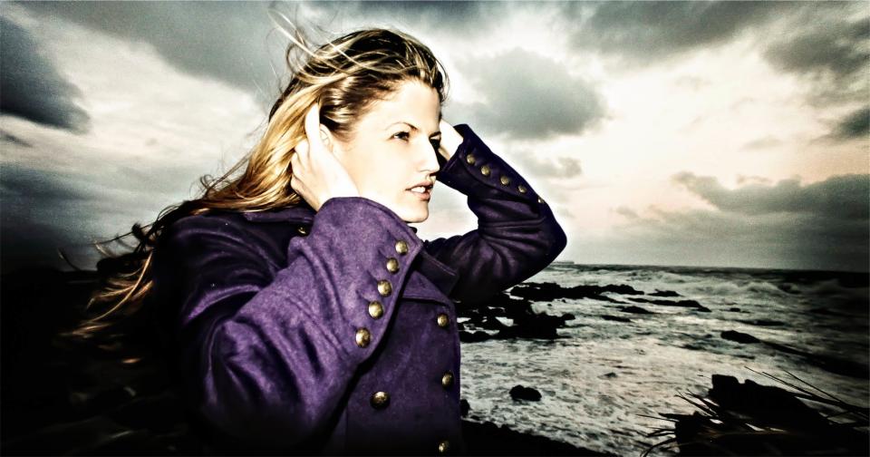 woman waves water sunset sky sea purple pretty ocean model longhair jacket girl fashion clouds blonde beautiful 