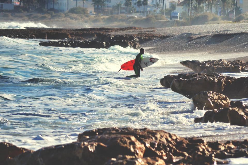 wetsuit waves water surfing surfer surfboard sports sea sand rocks ocean beach 