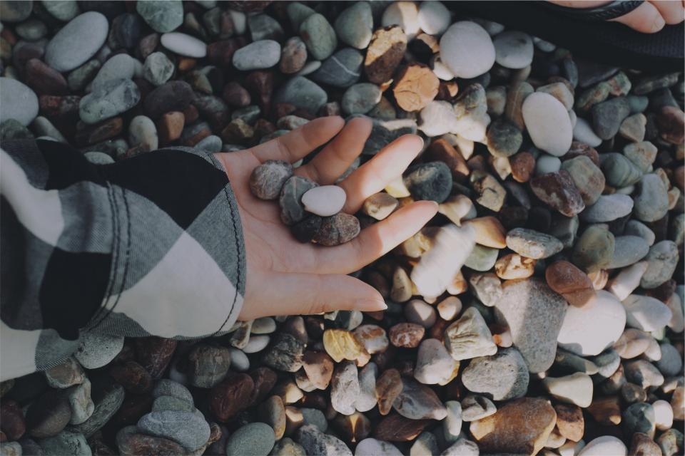 rocks pebbles hands 