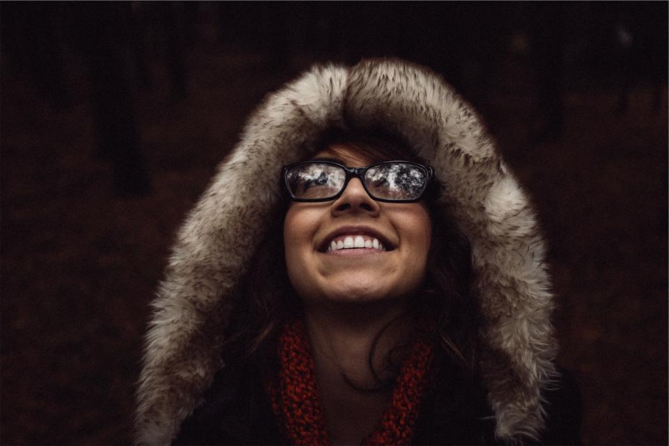 woman smiling people hood happy girl fur eyeglasses 