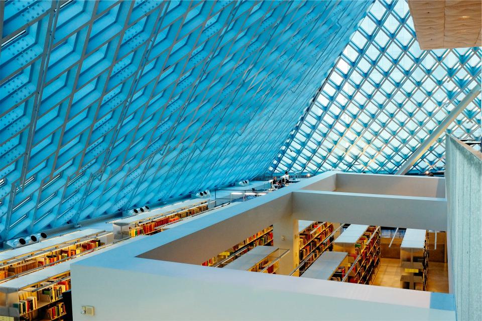 skylight shelves roof library glass ceiling building books beams architecture 